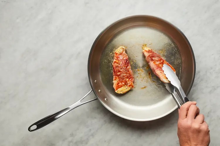 Searing prosciutto-wrapped chicken